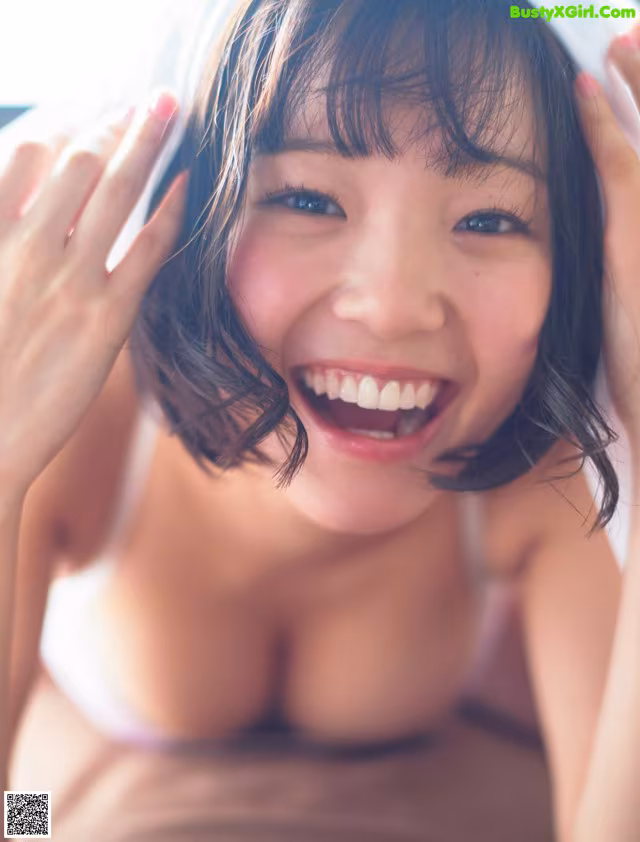 A woman with a big smile on her face.