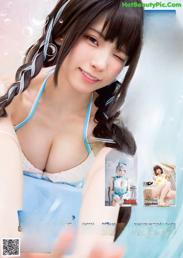 A woman in a blue bikini is posing for a magazine cover.